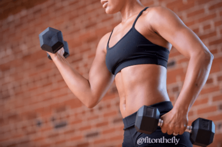 Arm Workout for Women at Home and Gym Woman doing arm workout with dumbbells at home